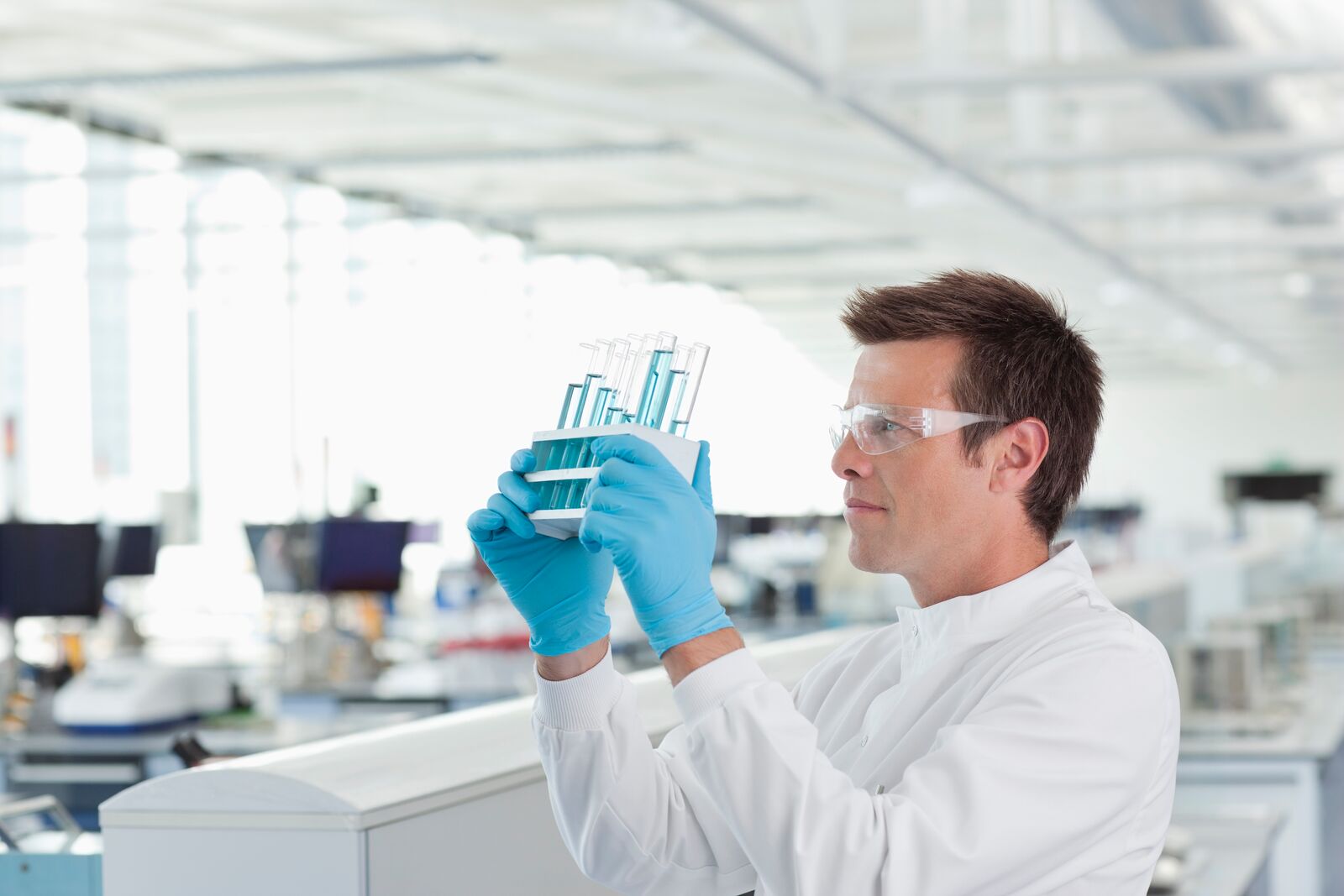 Scientist Examining Test Tubes in Laboratory