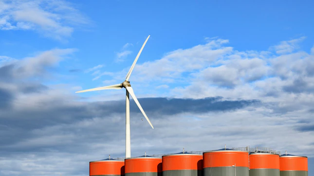 Wind Turbine behind Oil Storage Tanks Wind Turbine behind Oil Storage Tanks