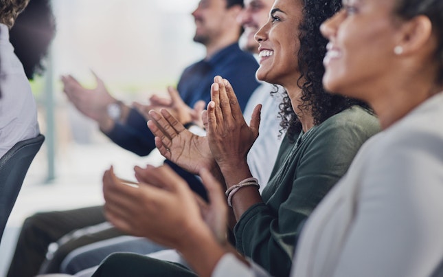 Audience Applauding at a Business Seminar