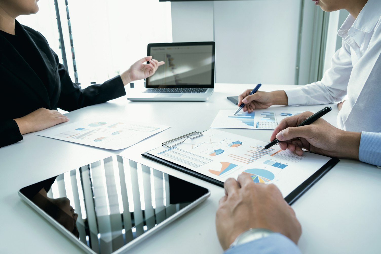 Business Colleagues Analysing Data