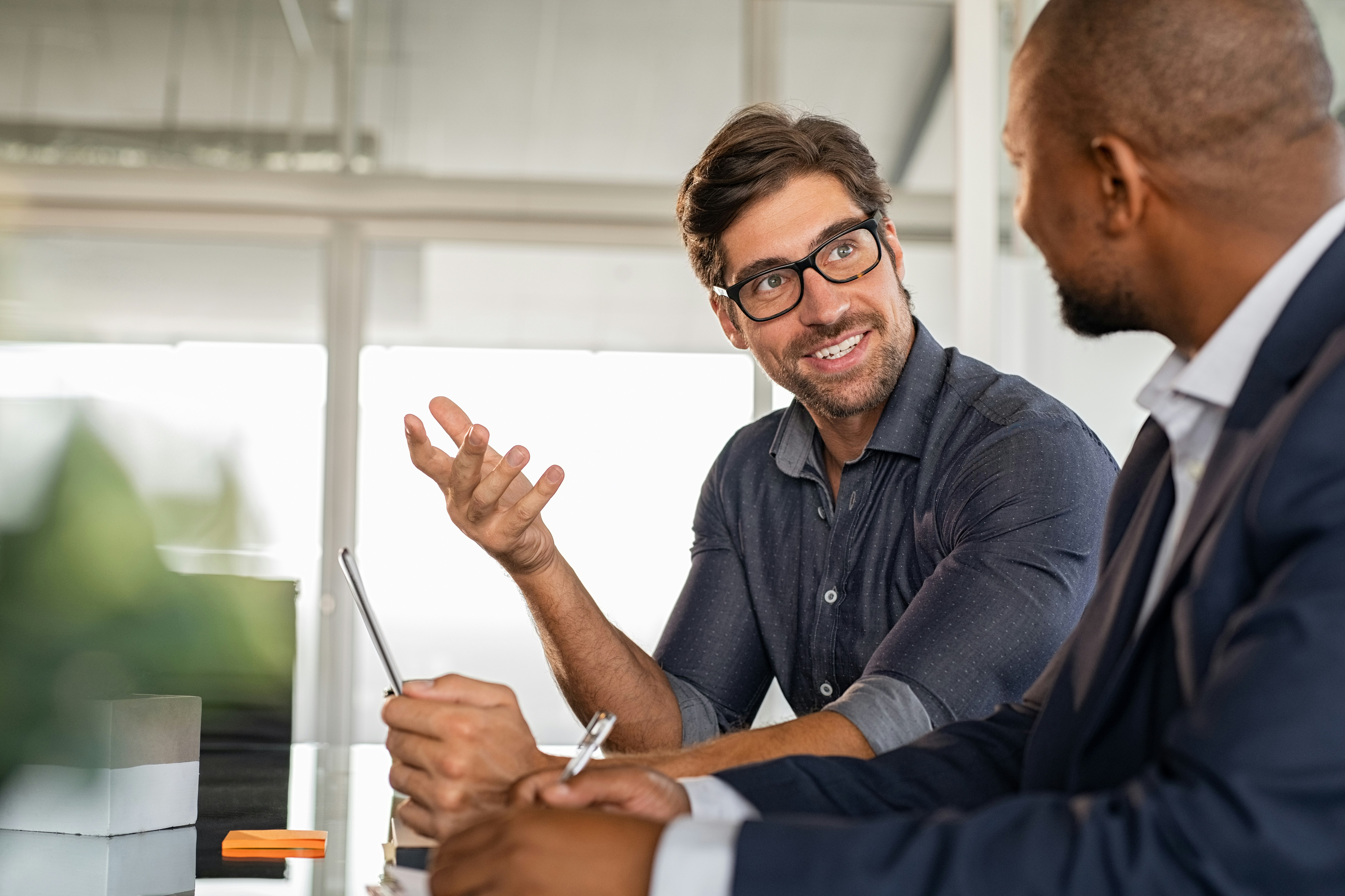 Businessmen Working Together at a Desk 2