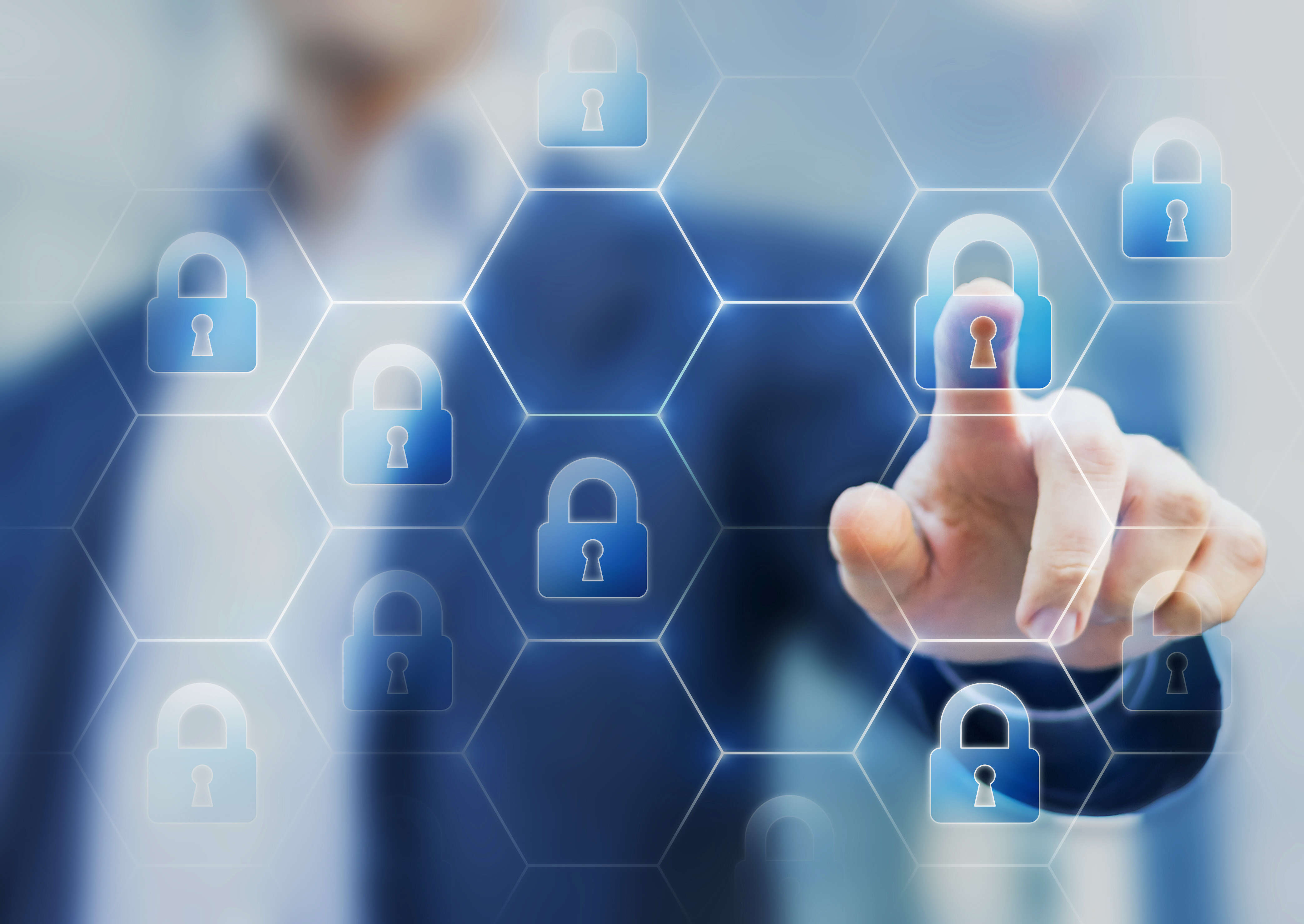 Security consultant touching a network of lock icons on a virtual screen, symbol of cybersecurity on internet and protection against cyber crime