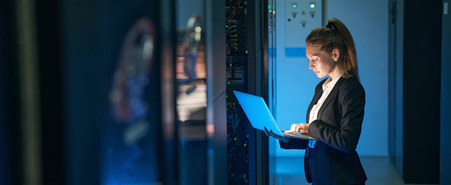 Engineer Working in Server Room