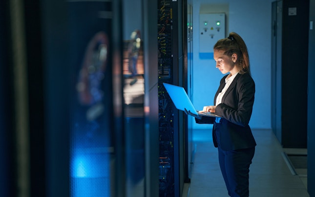 Engineer Working in Server Room