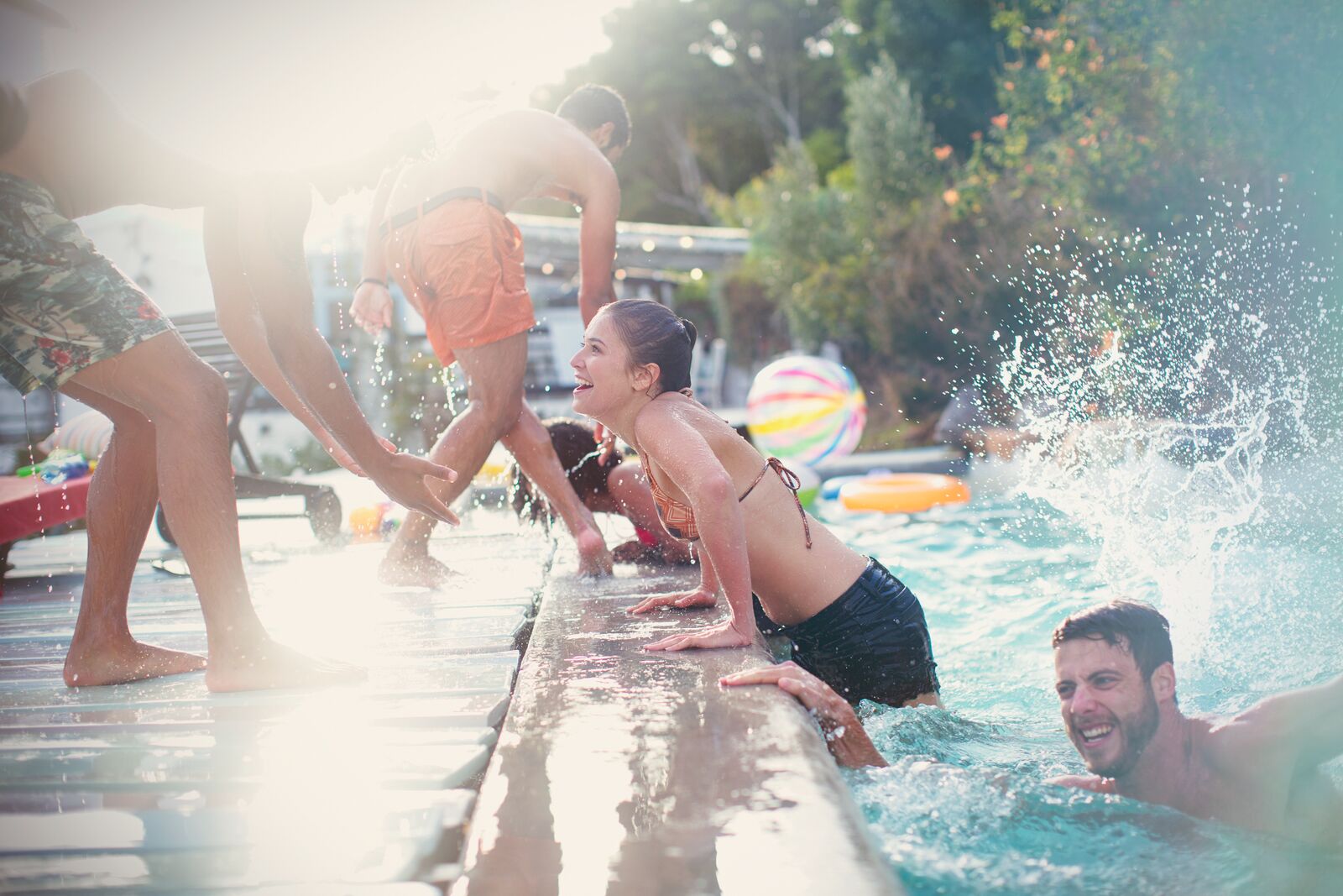 Friends Swimming in a Pool