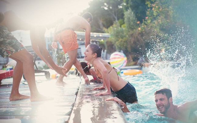 Friends Swimming in a Pool