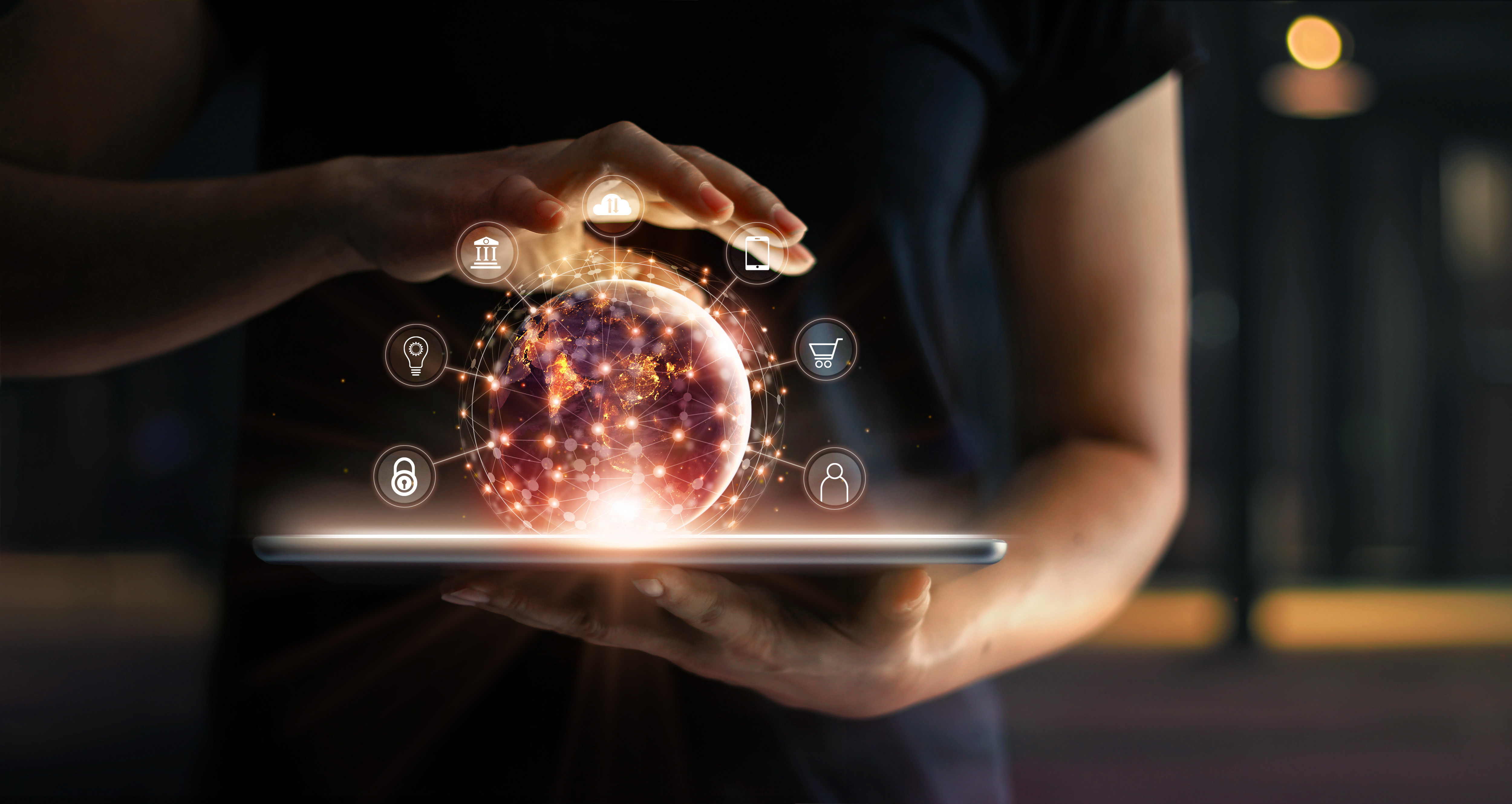 Man Holding Virtual Globe with Marketing Network Connecting Icons on Tablet