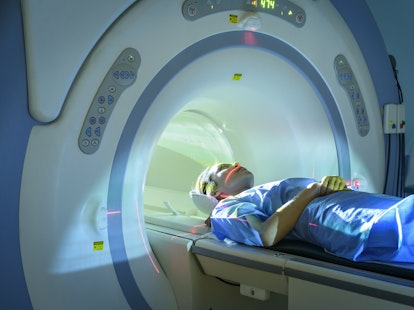 Patient entering Magnetic Resonance Imaging MRI scanner