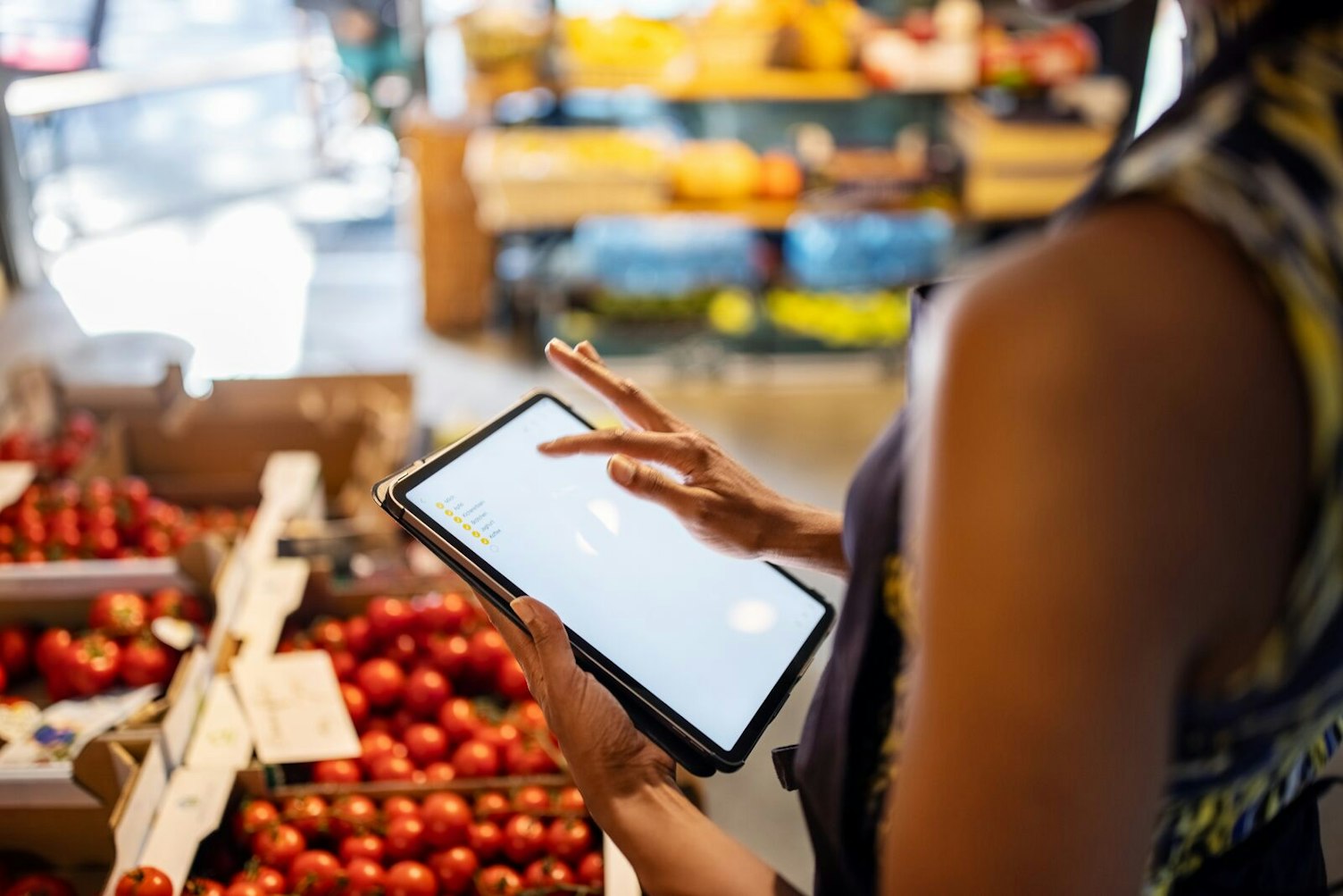 Salesperson Checking Inventory in a Grocery Store