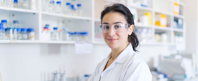 Scientist Standing with Arm Crossed