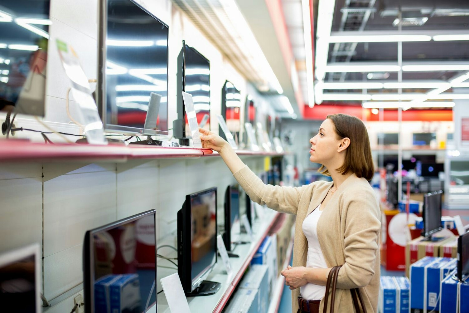 Woman Buying a TV in Store