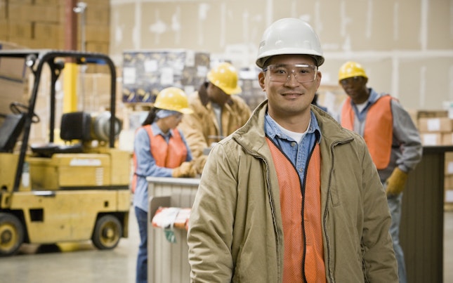 Worker wearing a safety helmet