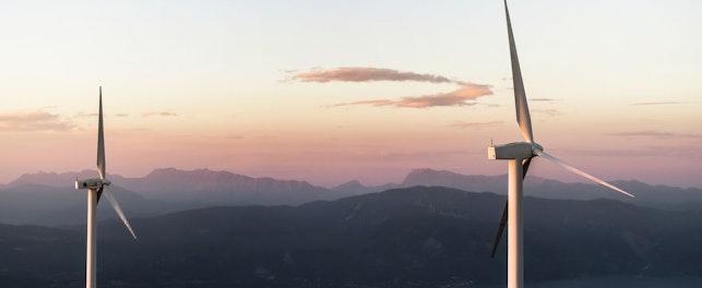 wind turbines on a hill-unsplash