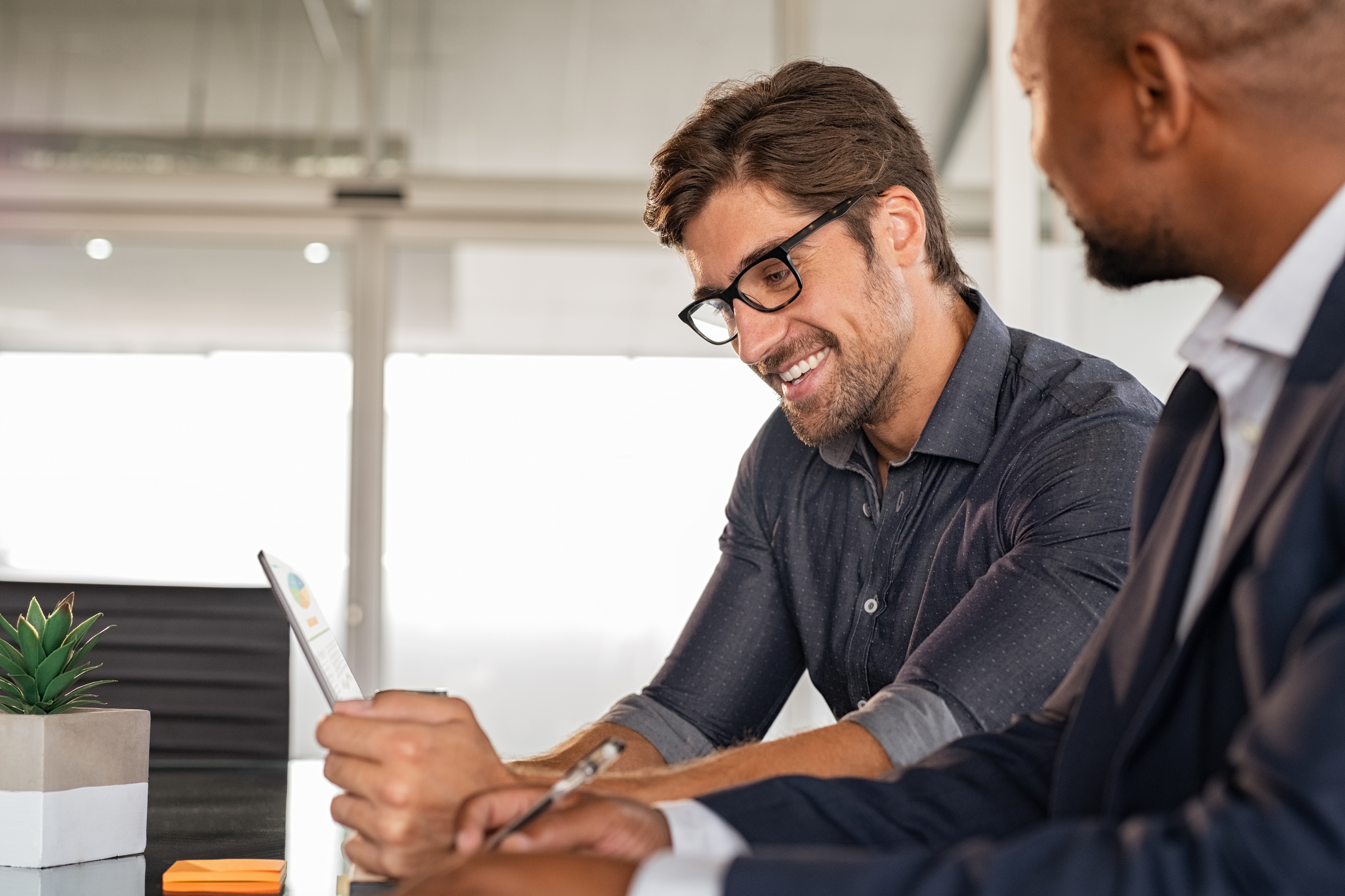 Businessmen Working Together at a Desk