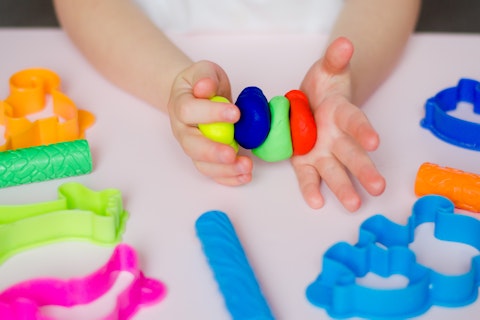Toddler Playing with Colourful Clay