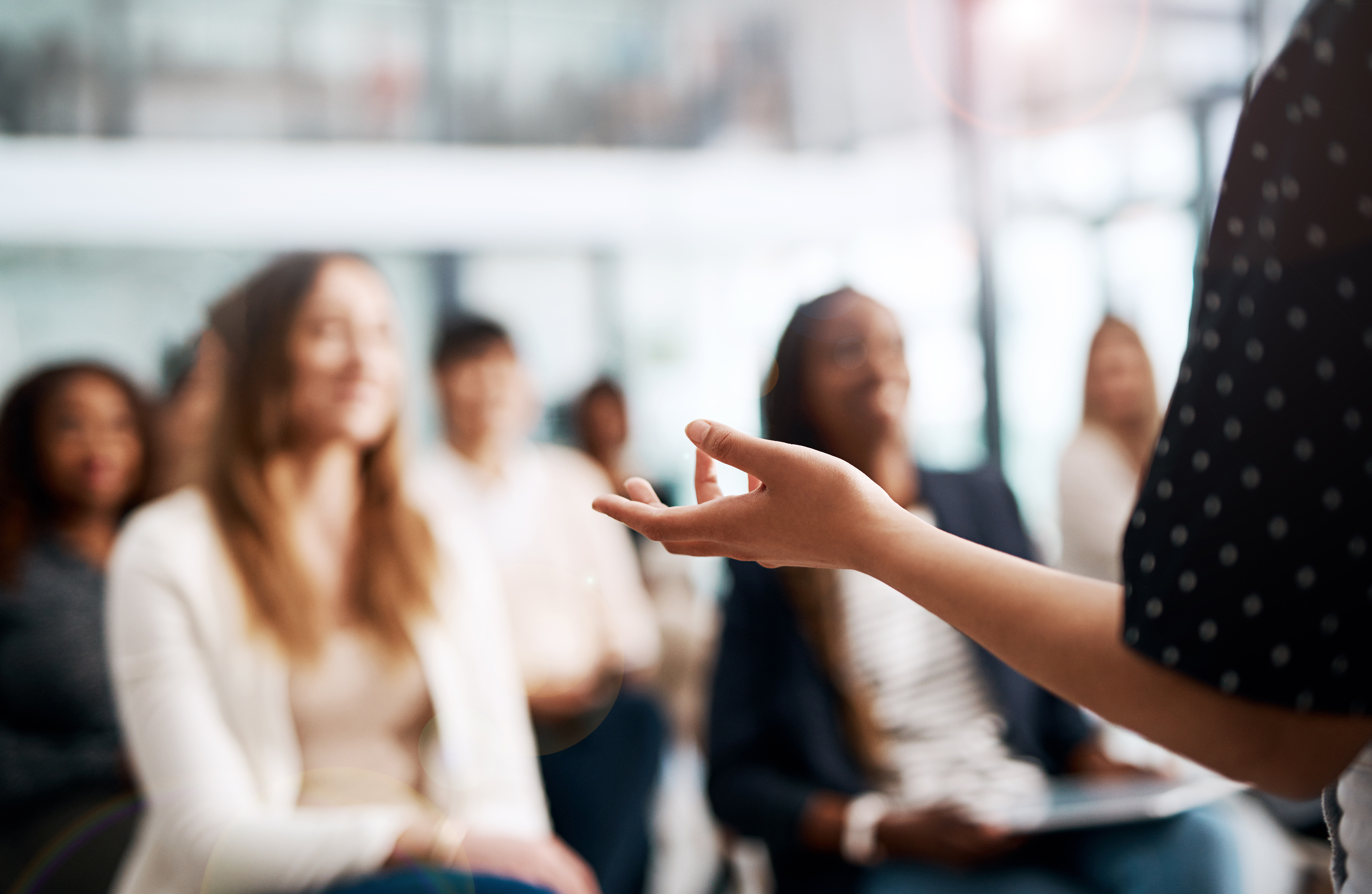 cropped shot of businesswoman delivering a speech during a conference
