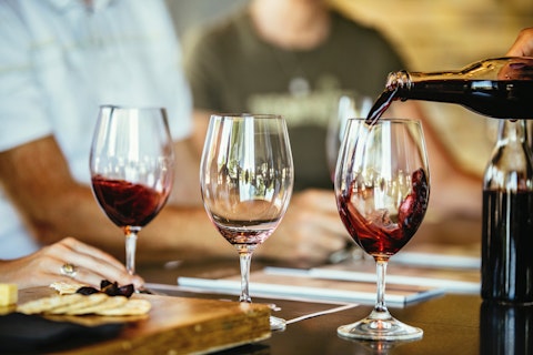 Wine Being Poured in Glasses