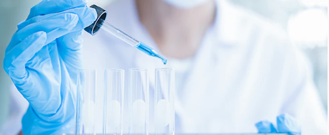 Scientist Researching with Chemical in Laboratory