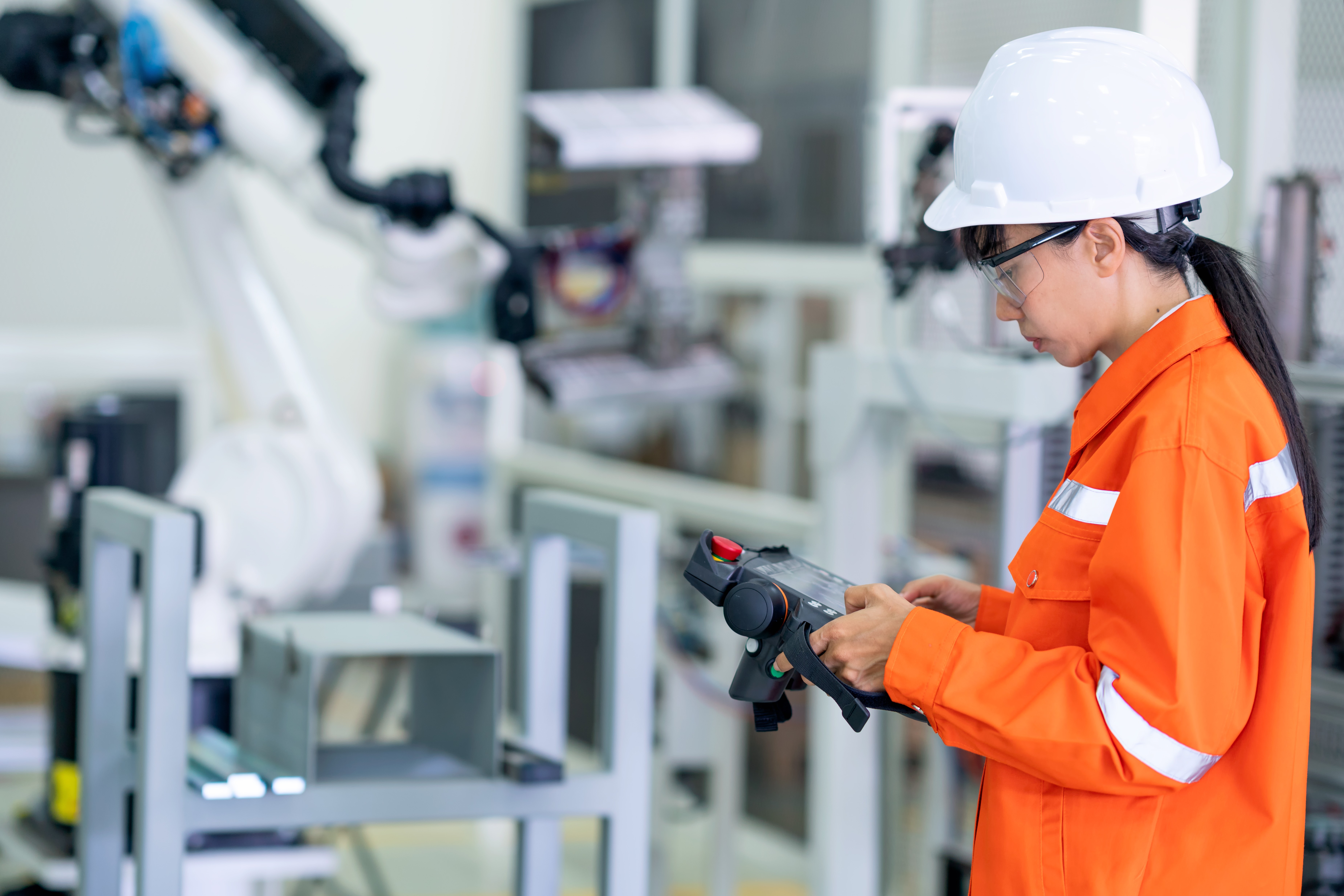 orig repairing robotic arm in research lab Getty-1267546847