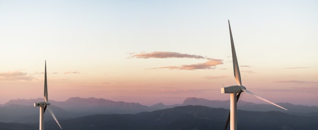Orig wind turbines on a hill-unsplash