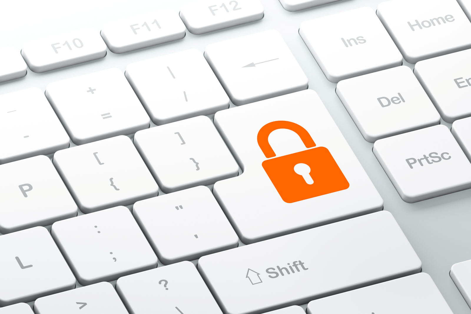 Klawiatura komputerowa z przyciskiem z ikonką zamkniętej kłódki.