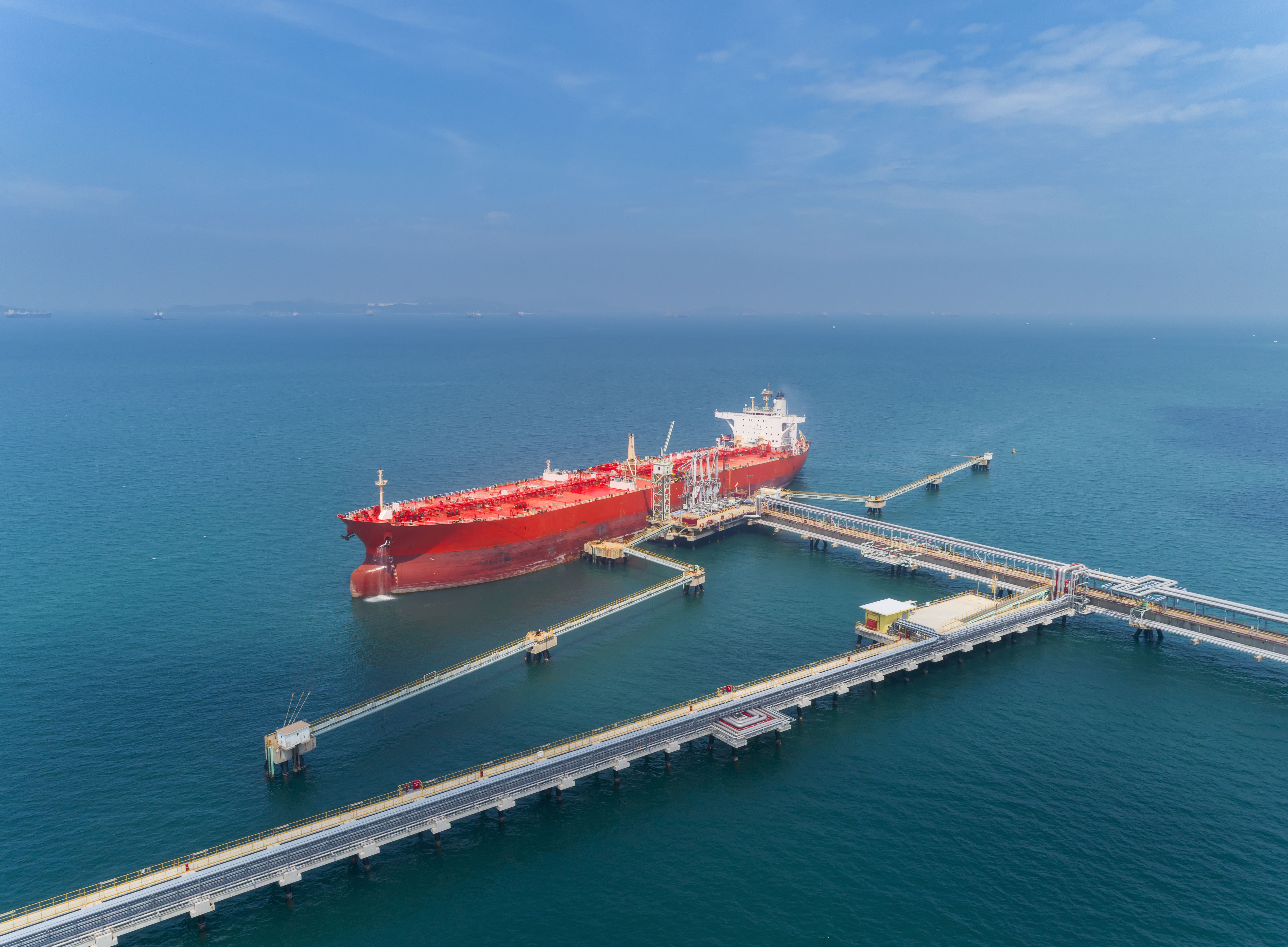 Aerial View of an Oil Ship Tanker Loading Oil from a Refinery Dock