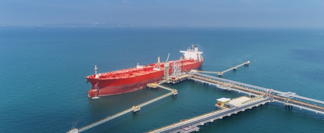 Aerial View of an Oil Ship Tanker Loading Oil from a Refinery Dock
