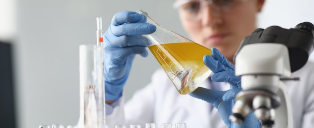Chemist Analysing Oil in Laboratory