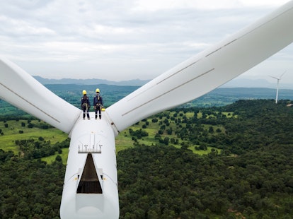 Electric Engineers Working on top of a Wind Turbine