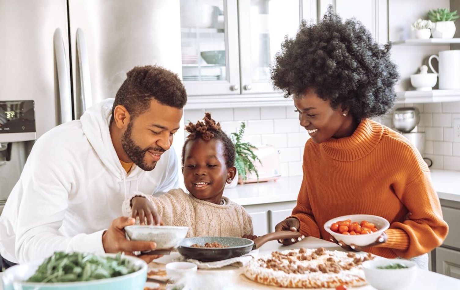 Family cooking together in the kitchen
