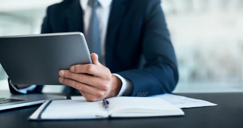 Man Working on a Digital Tablet