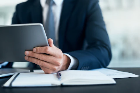 Man Working on a Digital Tablet