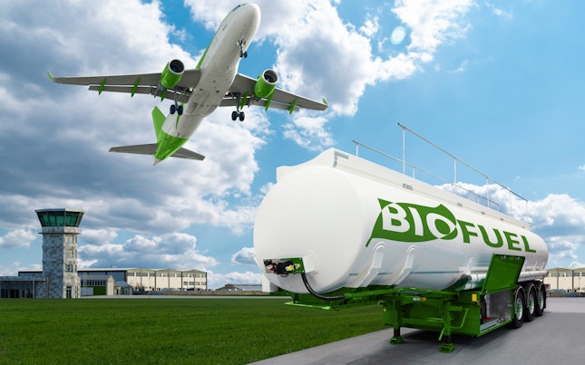 Airplane Flying above Biofuel Tank at an Airport