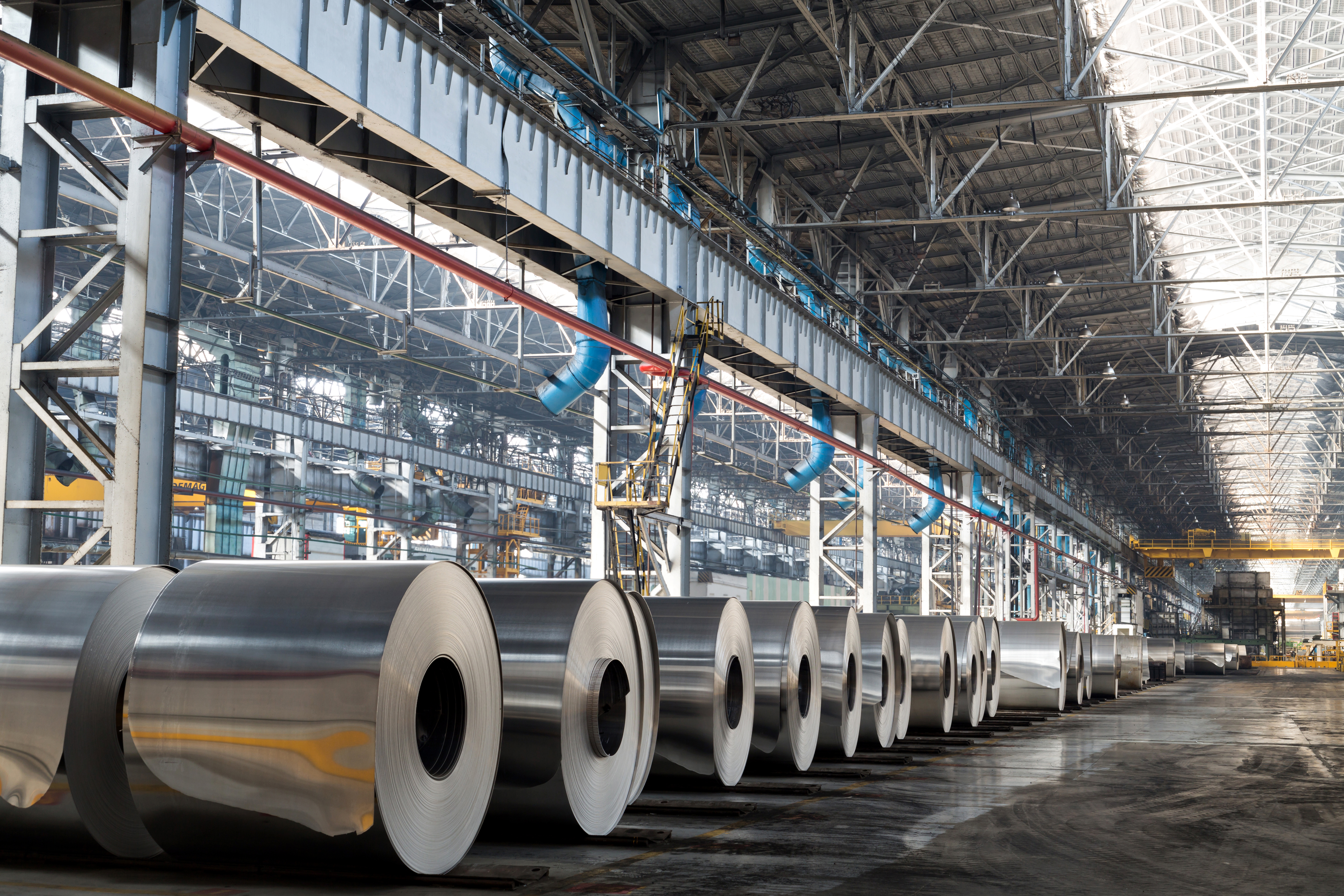 Long Row of Rolls of Aluminum in Production Shop of Plant
