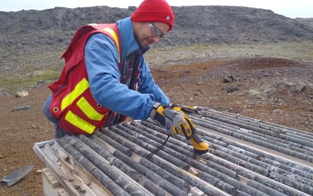 Man Looking at Drill Core