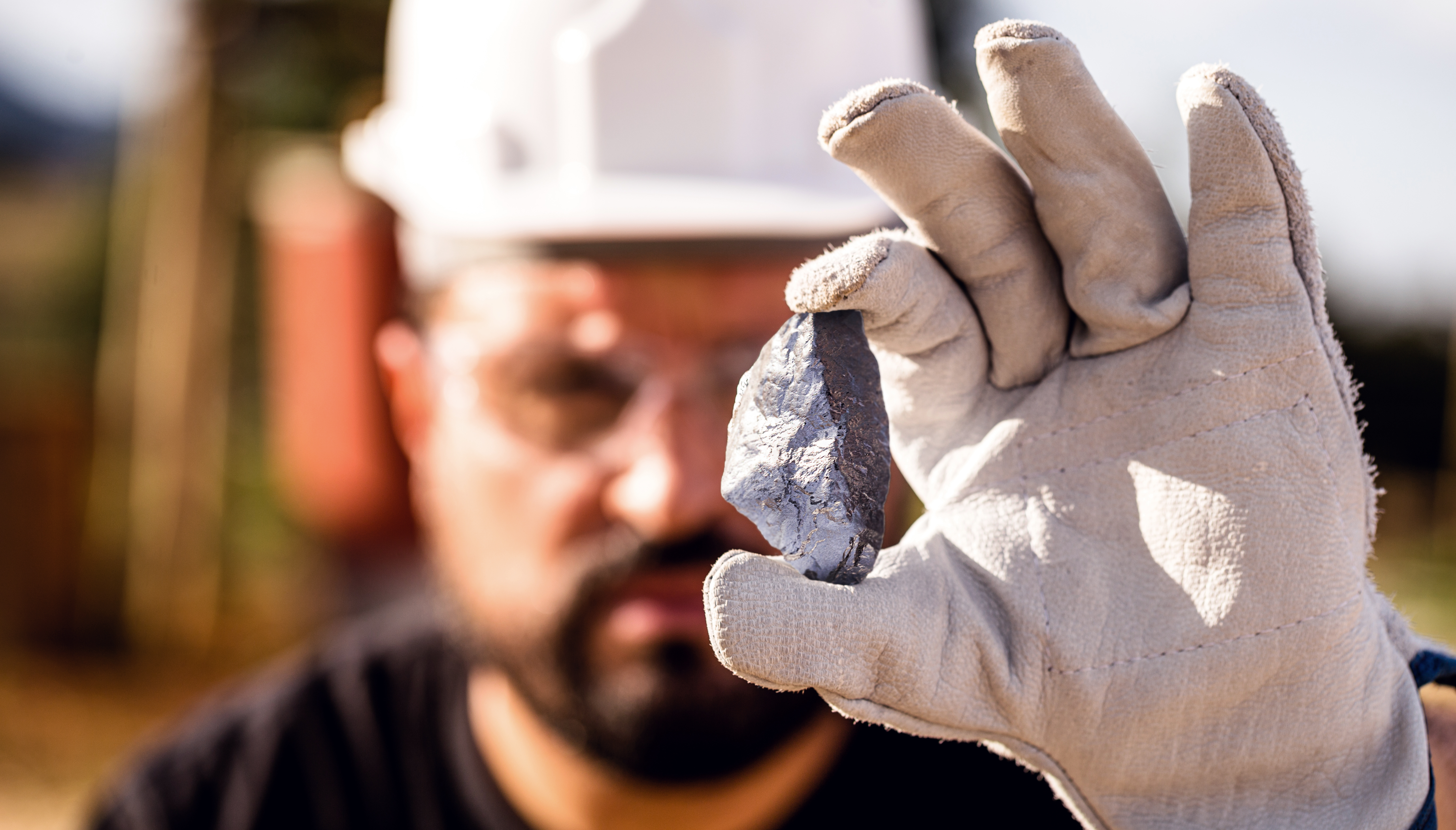 Miner Man Holding a Silver Stone, Point Focus