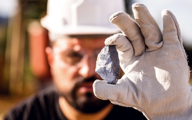 Miner Man Holding a Silver Stone, Point Focus