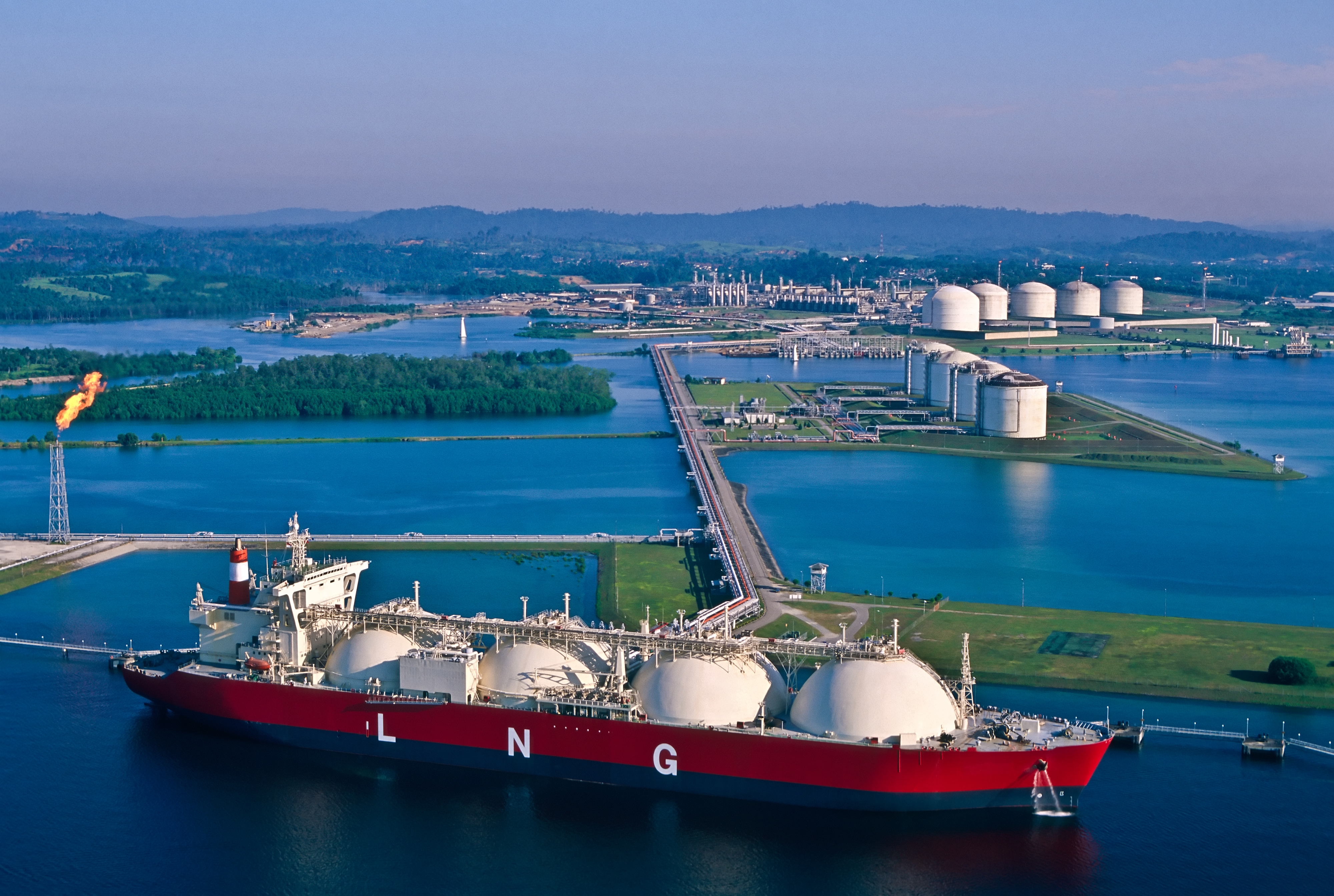 Natural Gas Tanker at Port with LNG Liquefaction Plant