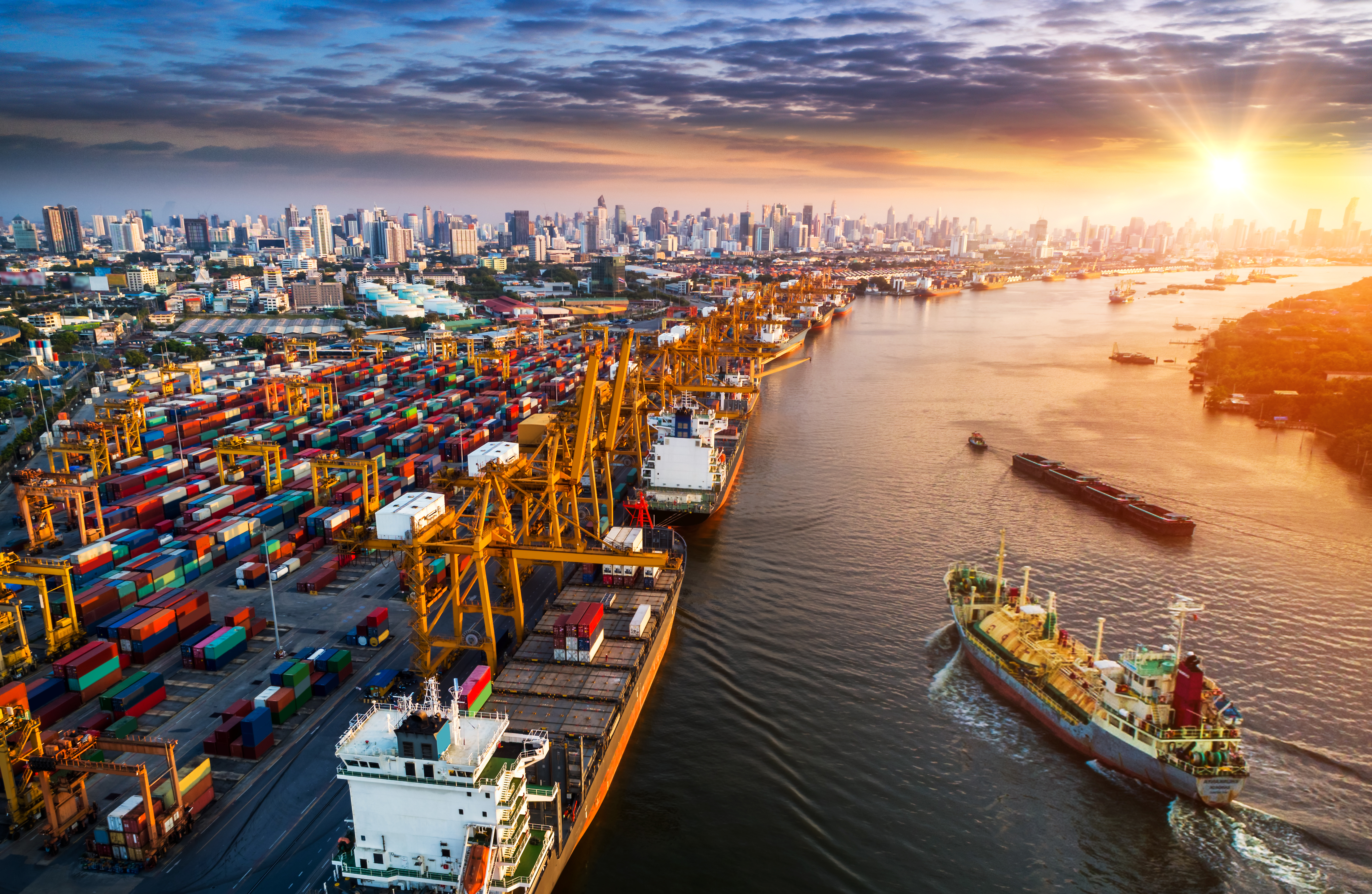 Container ship in import export and business logistic, By crane, Trade Port, Shipping cargo to harbor, Aerial view from drone, International transportation, Business logistics concept.