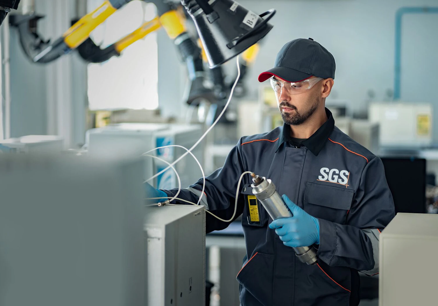 SGS Laboratory Assistant Loads Sample into the Chromatograph