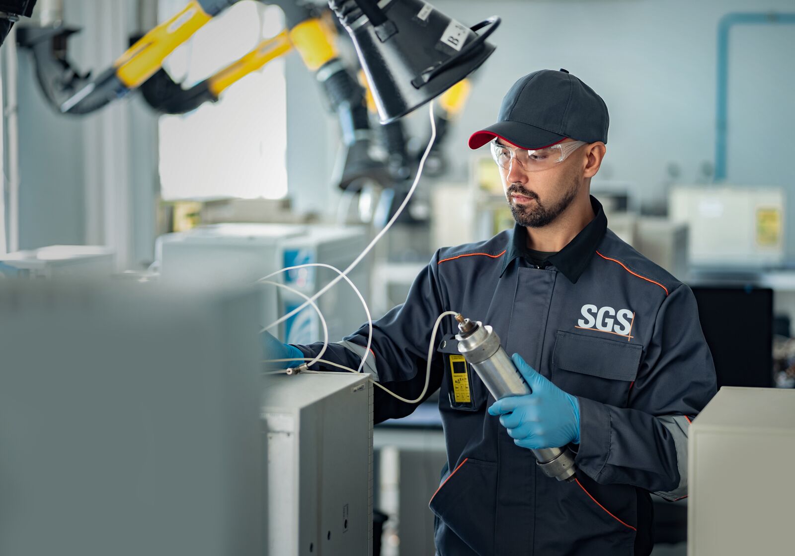 SGS Laboratory Assistant Loads Sample into the Chromatograph