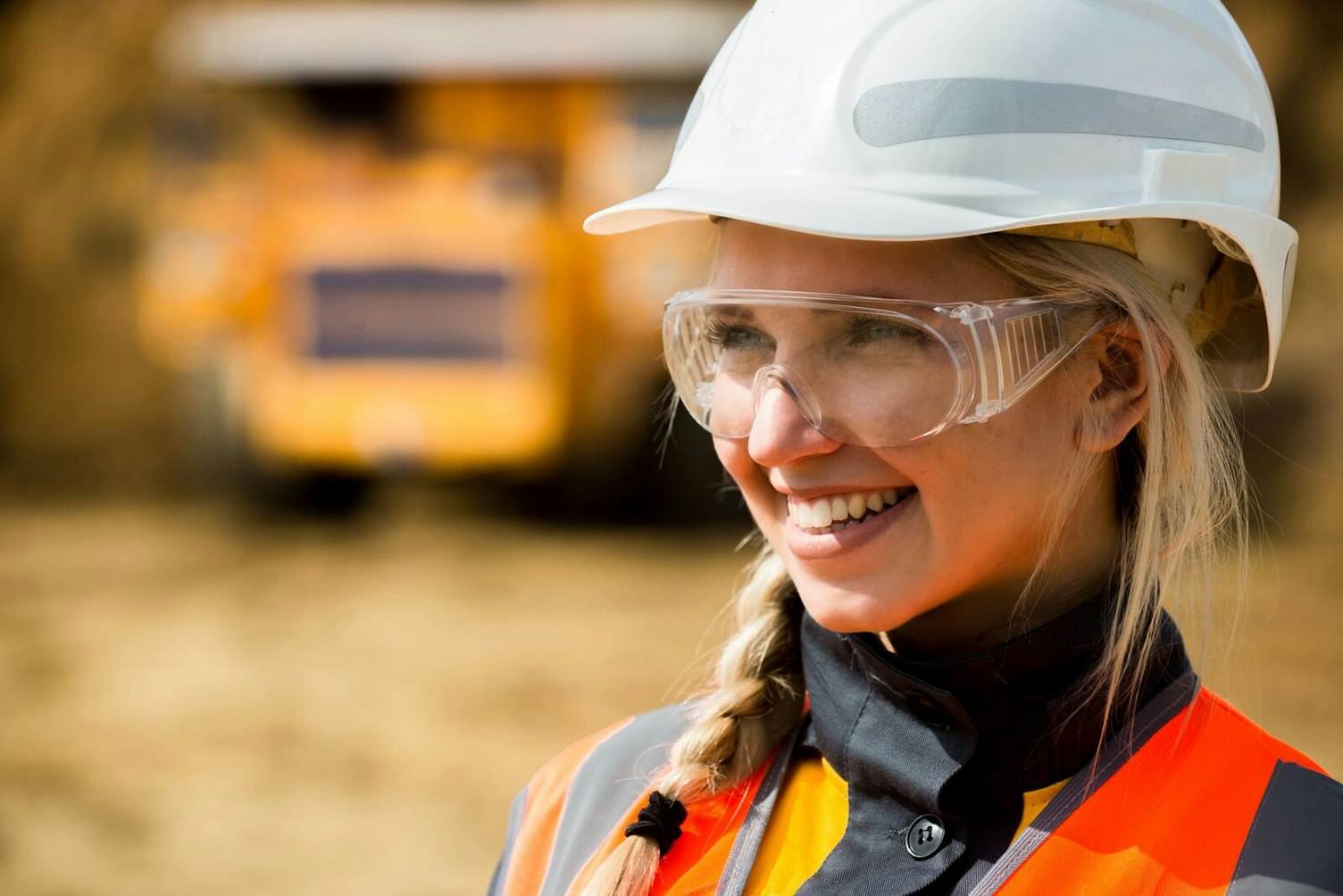 Smiling Mine Worker in Open Pit