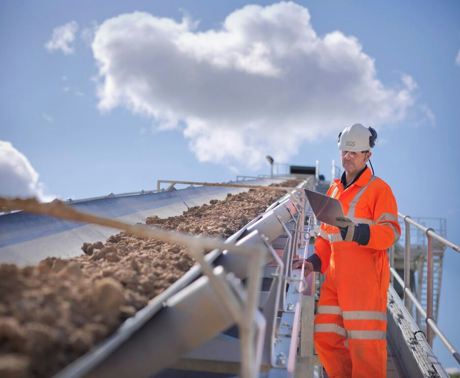 Worker Inspecting Stone Screening