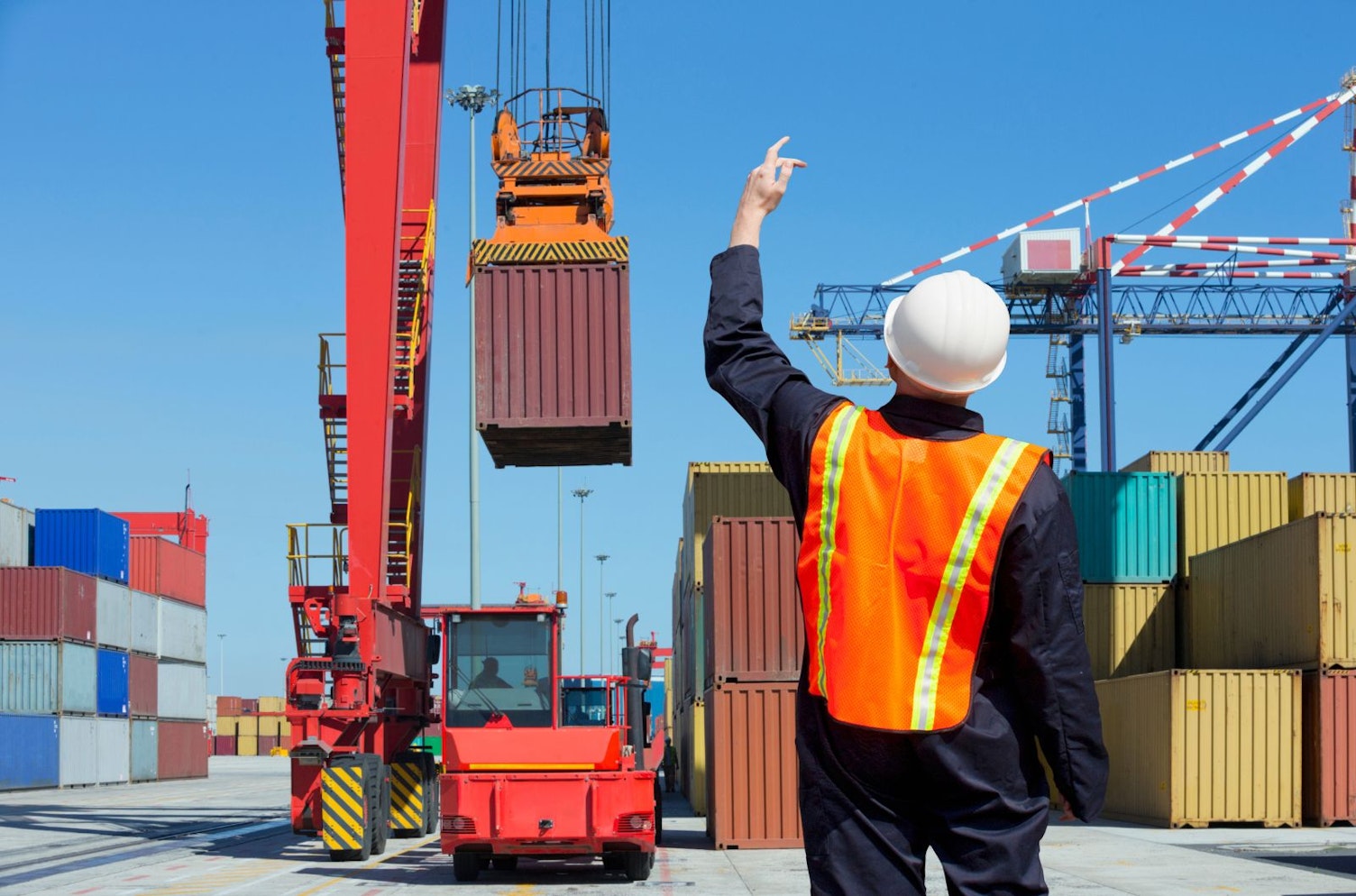 Worker Supervising Loading of Containers