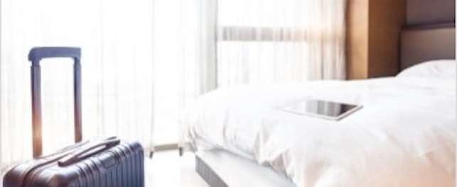 Hotel Bed with Luggage