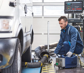 Mechanic beside a car