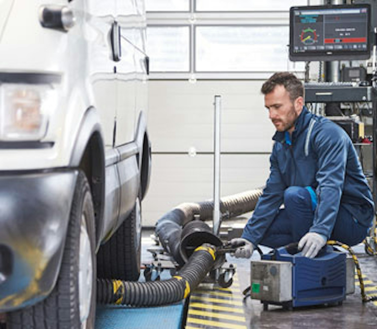 Mechanic beside a car