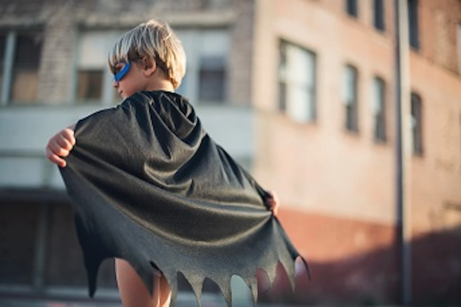boy wearing black batman capeunsplash 344