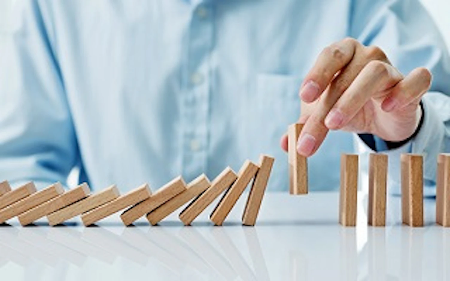 cards Guy playing with wooden dominoes 320px