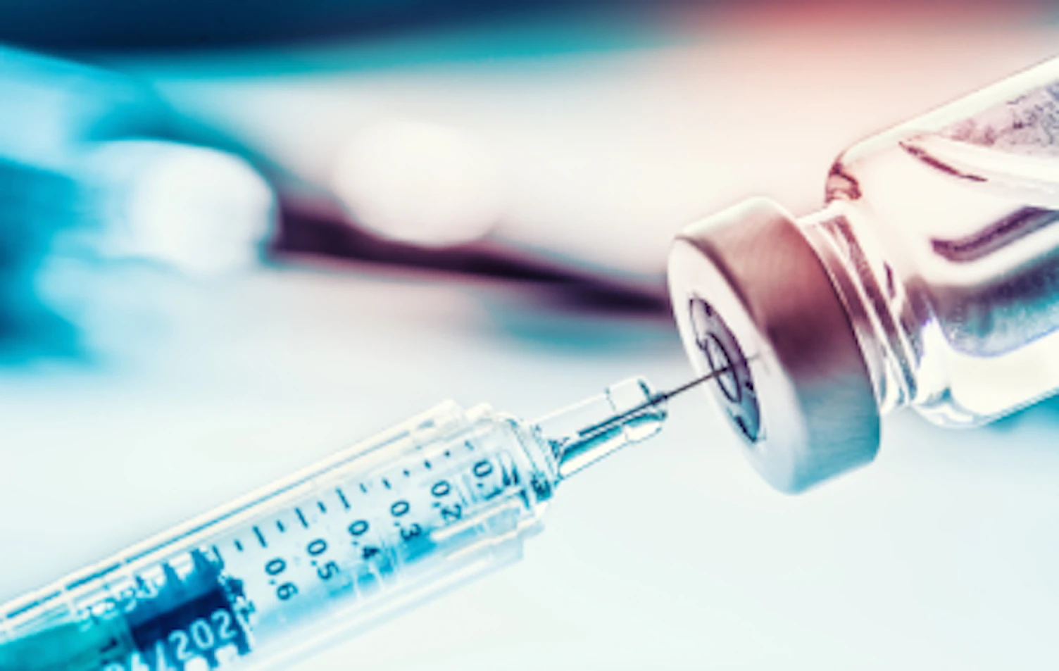 closeup medical syringe with a vaccine